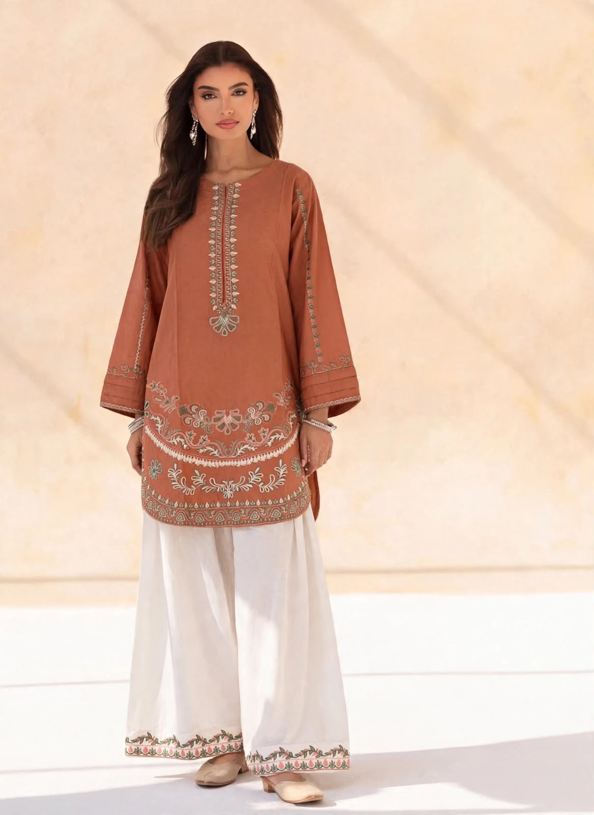 Rust embroidered cotton kurta with ivory wide-leg embroidered trousers, two-piece stitched suit